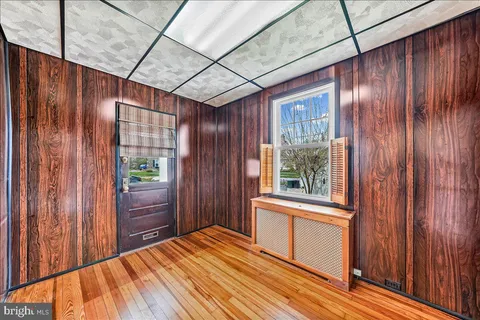 a room with a bed and a chandelier