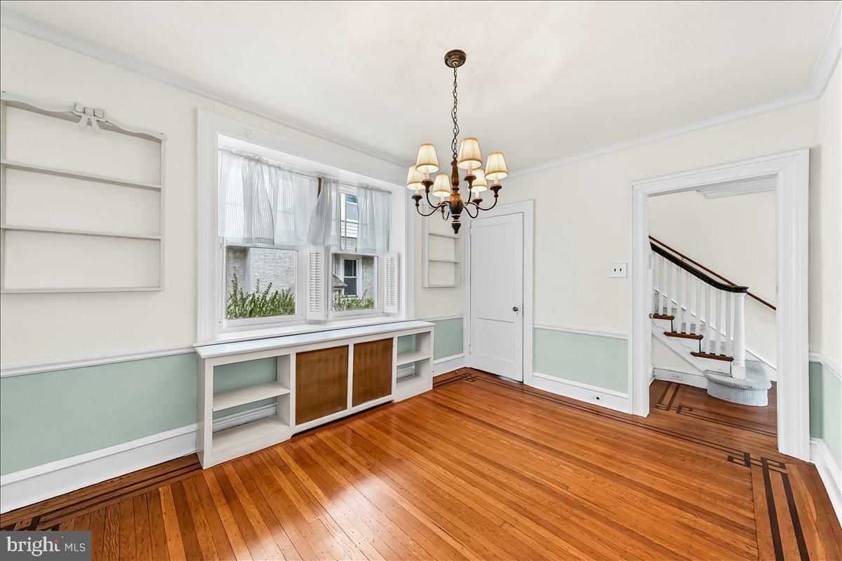 216 East Manoa Road Havertown, PA 19083 - Photo 14 of 37 a room with a bed and a chandelier