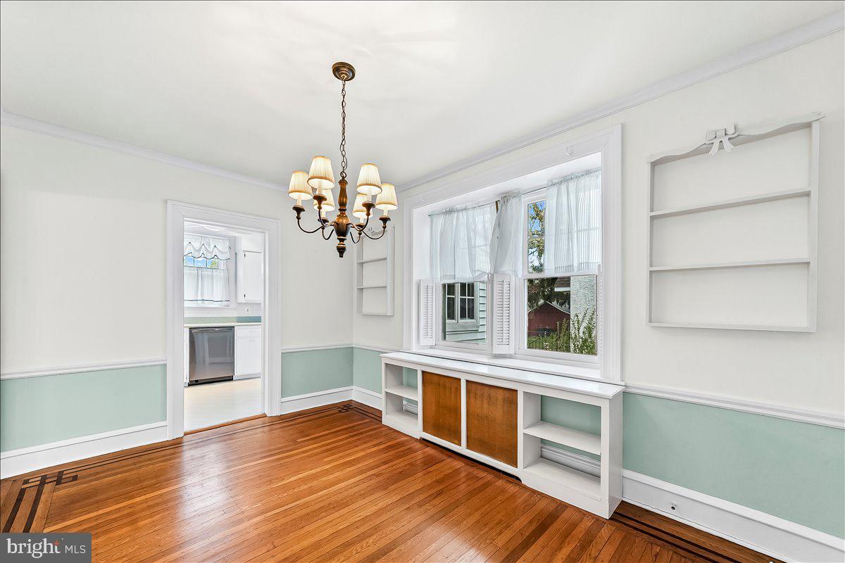 216 East Manoa Road Havertown, PA 19083 - Photo 15 of 37 a view of an empty room with a window and kitchen view