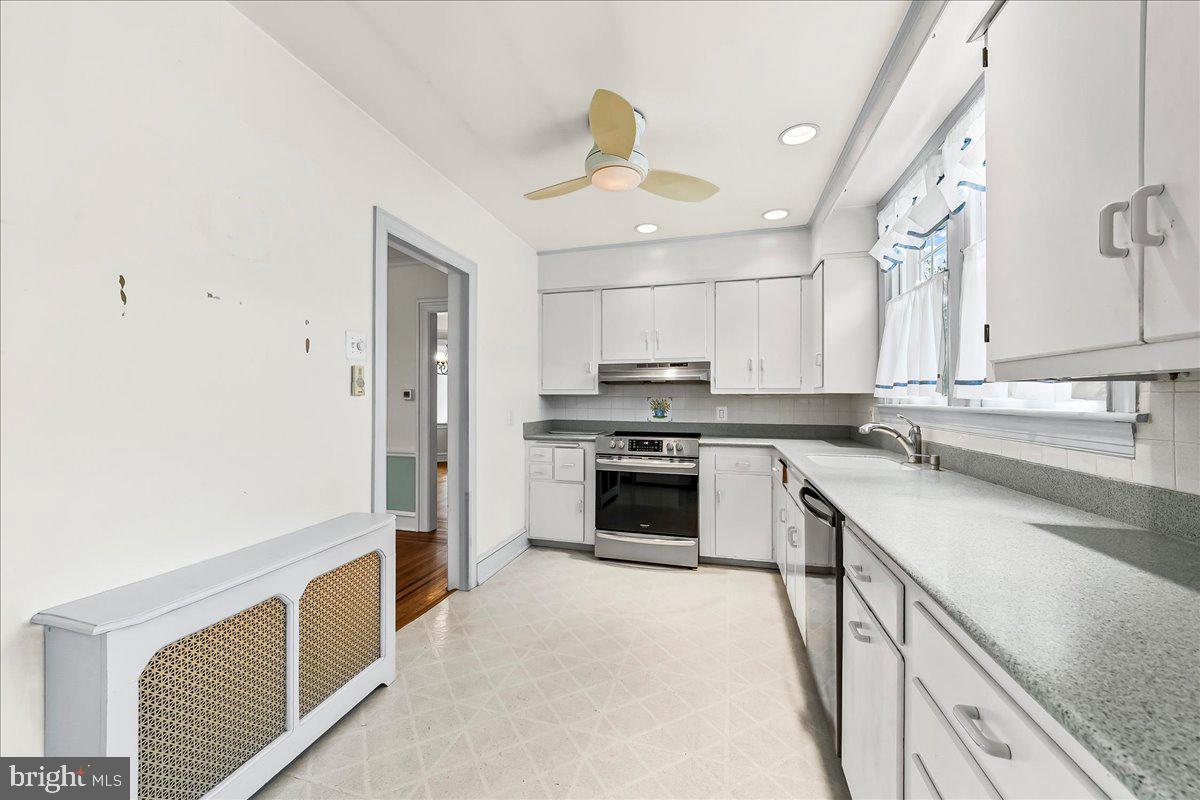 216 East Manoa Road Havertown, PA 19083 - Photo 18 of 37 a kitchen with stainless steel appliances granite countertop a stove and a sink