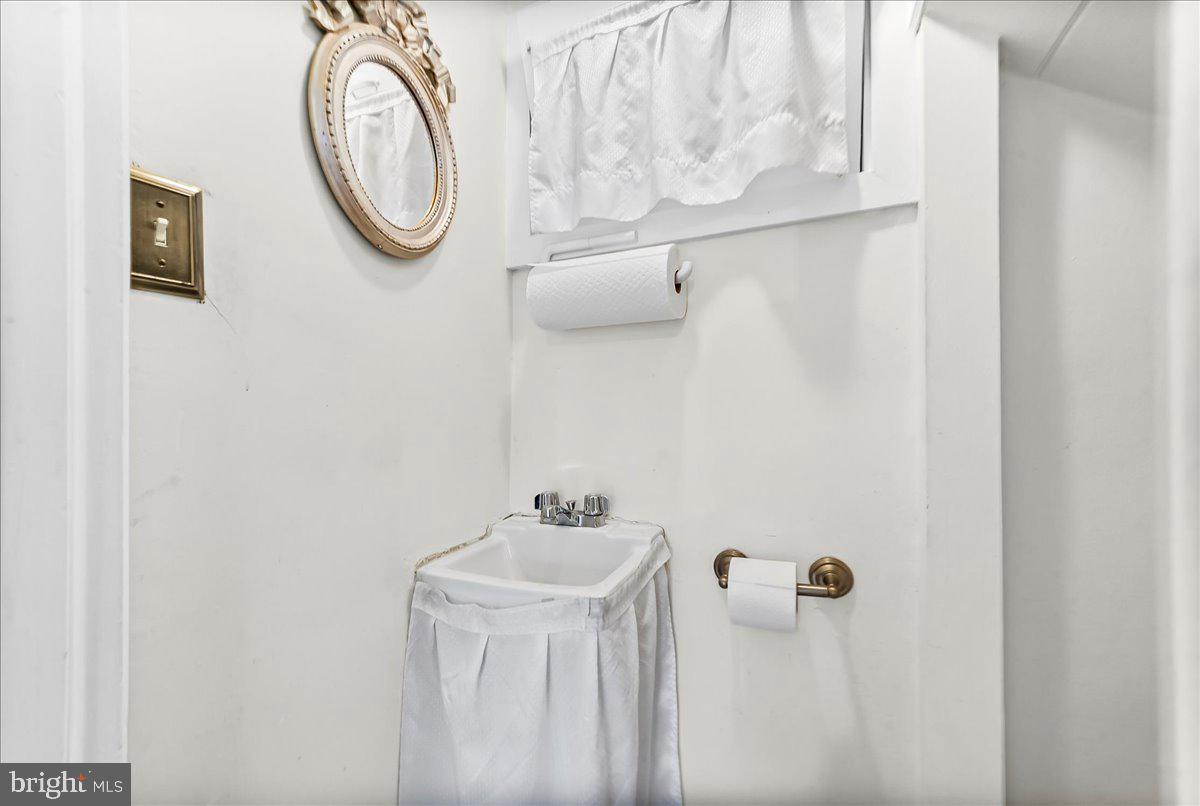 216 East Manoa Road Havertown, PA 19083 - Photo 19 of 37 a bathroom with a sink and a mirror