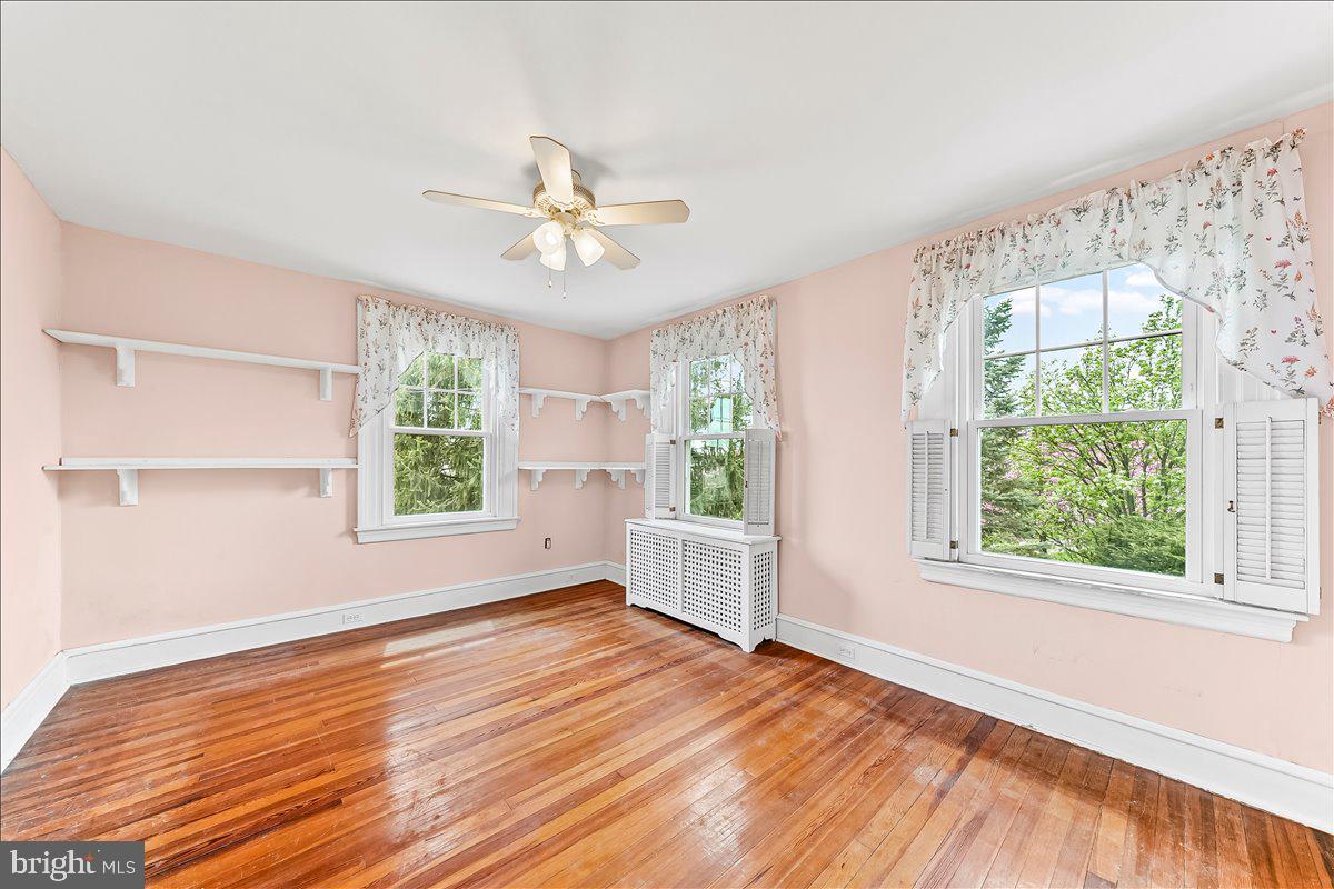 216 East Manoa Road Havertown, PA 19083 - Photo 21 of 37 a view of empty room with wooden floor and fan