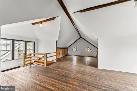 a view of a house with a wooden deck