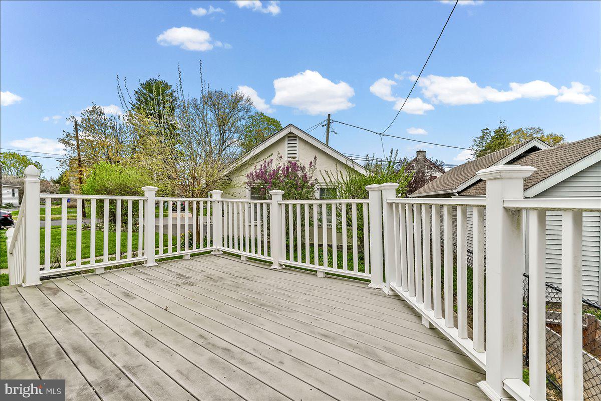 216 East Manoa Road Havertown, PA 19083 - Photo 26 of 37 a view of a house with a wooden deck