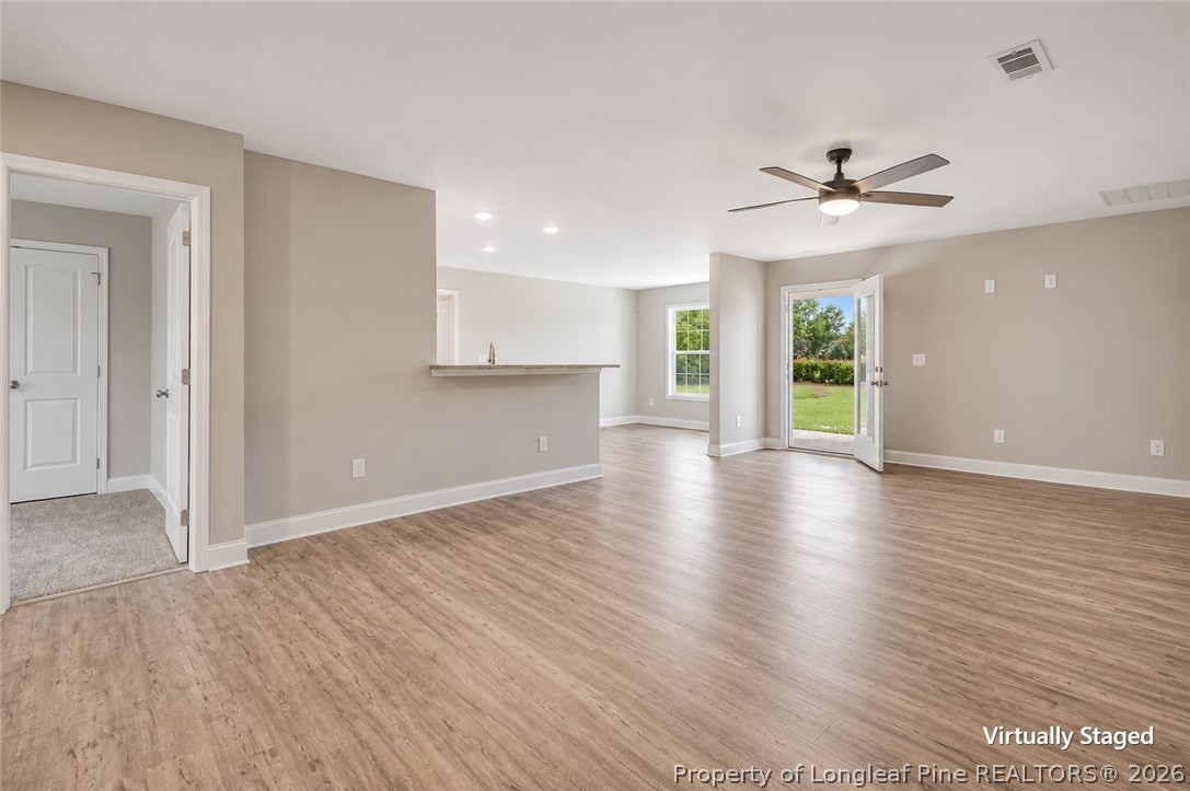 756 Jordan Road Autryville, NC 28318 - Photo 18 of 34 a view of an empty room with window and wooden floor