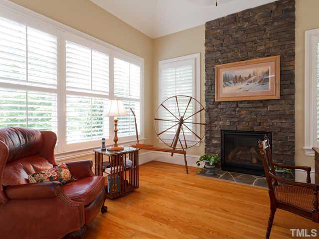 11300 Moonsprite Way Raleigh, NC 27614 - Photo 12 of 25 a living room with furniture a large window and a fireplace