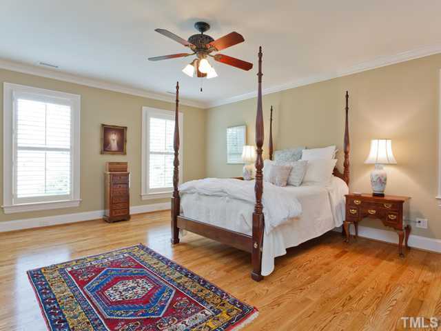 11300 Moonsprite Way Raleigh, NC 27614 - Photo 13 of 25 a bedroom with a bed and wooden floor