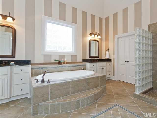 11300 Moonsprite Way Raleigh, NC 27614 - Photo 15 of 25 a spacious bathroom with a tub sink and mirror