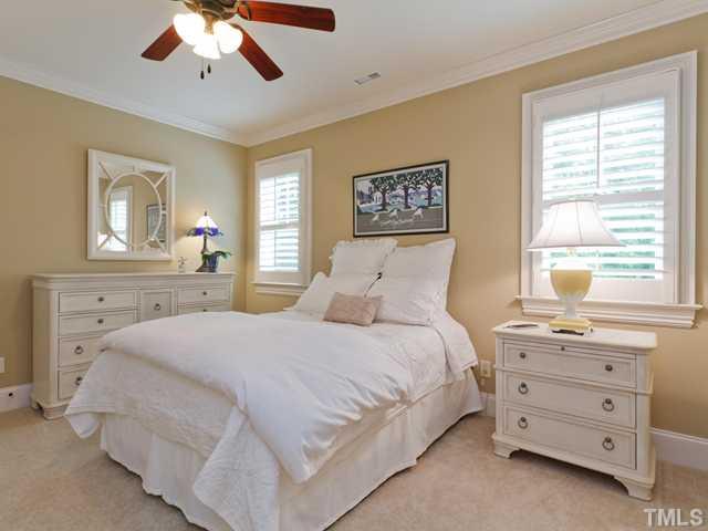 11300 Moonsprite Way Raleigh, NC 27614 - Photo 17 of 25 a bedroom with a bed and a dresser