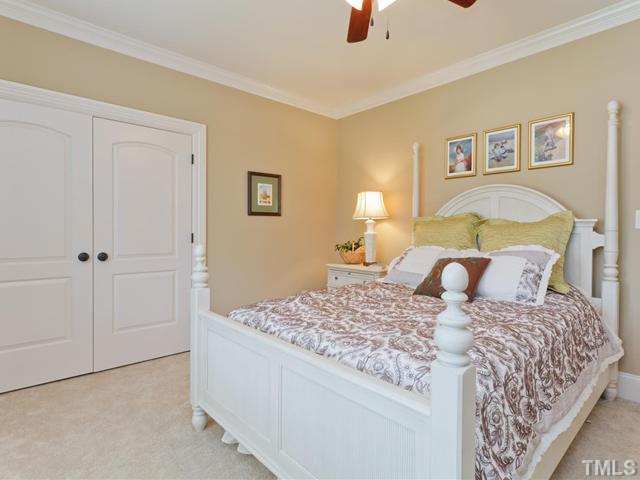 11300 Moonsprite Way Raleigh, NC 27614 - Photo 18 of 25 a bedroom with a bed and a painting on the wall