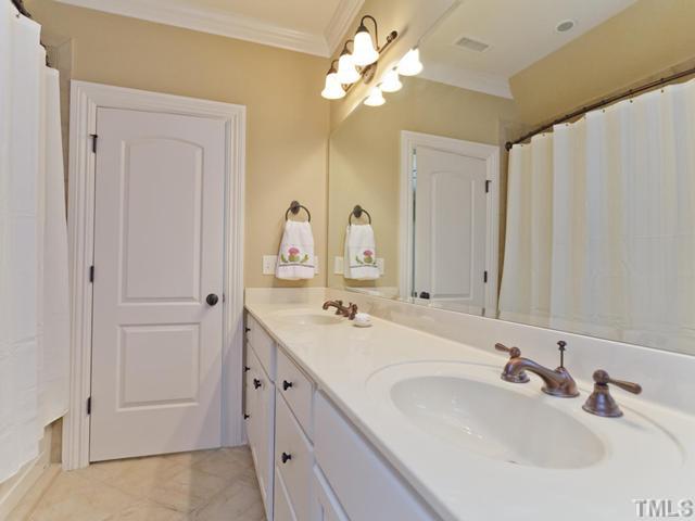 11300 Moonsprite Way Raleigh, NC 27614 - Photo 19 of 25 a bathroom with a double vanity sink and a mirror