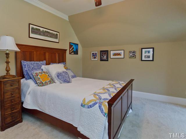 11300 Moonsprite Way Raleigh, NC 27614 - Photo 20 of 25 a bedroom with a bed and painting on the wall