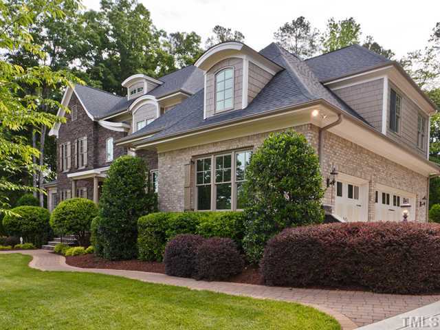 11300 Moonsprite Way Raleigh, NC 27614 - Photo 2 of 25 a front view of a house with a garden