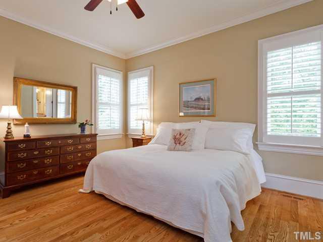 11300 Moonsprite Way Raleigh, NC 27614 - Photo 22 of 25 a bedroom with a bed and a dresser next to a window