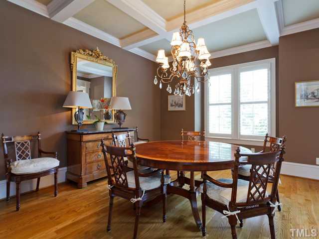 11300 Moonsprite Way Raleigh, NC 27614 - Photo 4 of 25 a view of a dining room with furniture a chandelier and wooden floor