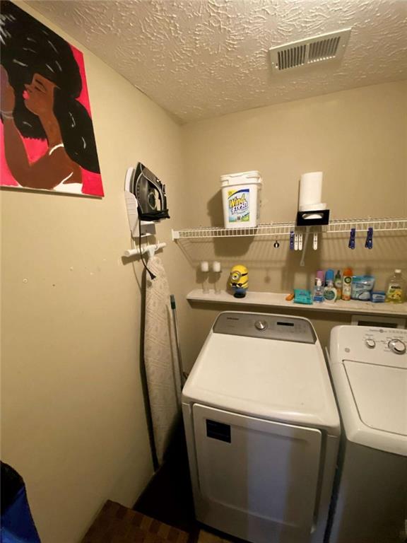 188 Waters Edge Drive Locust Grove, GA 30248 - Photo 17 of 25 a utility room with dryer and washer