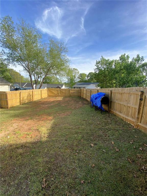 188 Waters Edge Drive Locust Grove, GA 30248 - Photo 18 of 25 a view of an outdoor space and yard