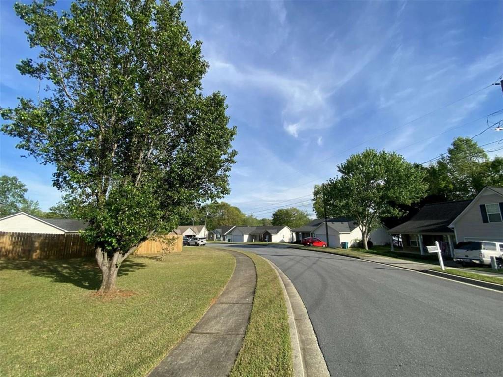 188 Waters Edge Drive Locust Grove, GA 30248 - Photo 20 of 25 a view of street with cars