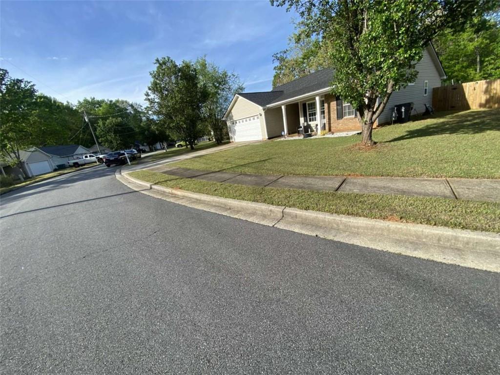 188 Waters Edge Drive Locust Grove, GA 30248 - Photo 3 of 25 a view of a house with a street