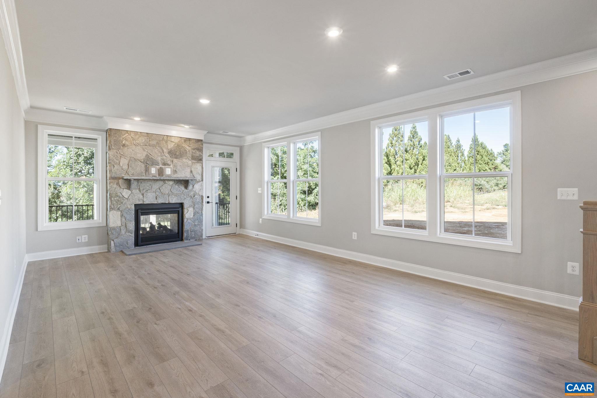 84 Springdale Road Waynesboro, VA 22980 - Photo 14 of 55 an empty room with windows and fireplace