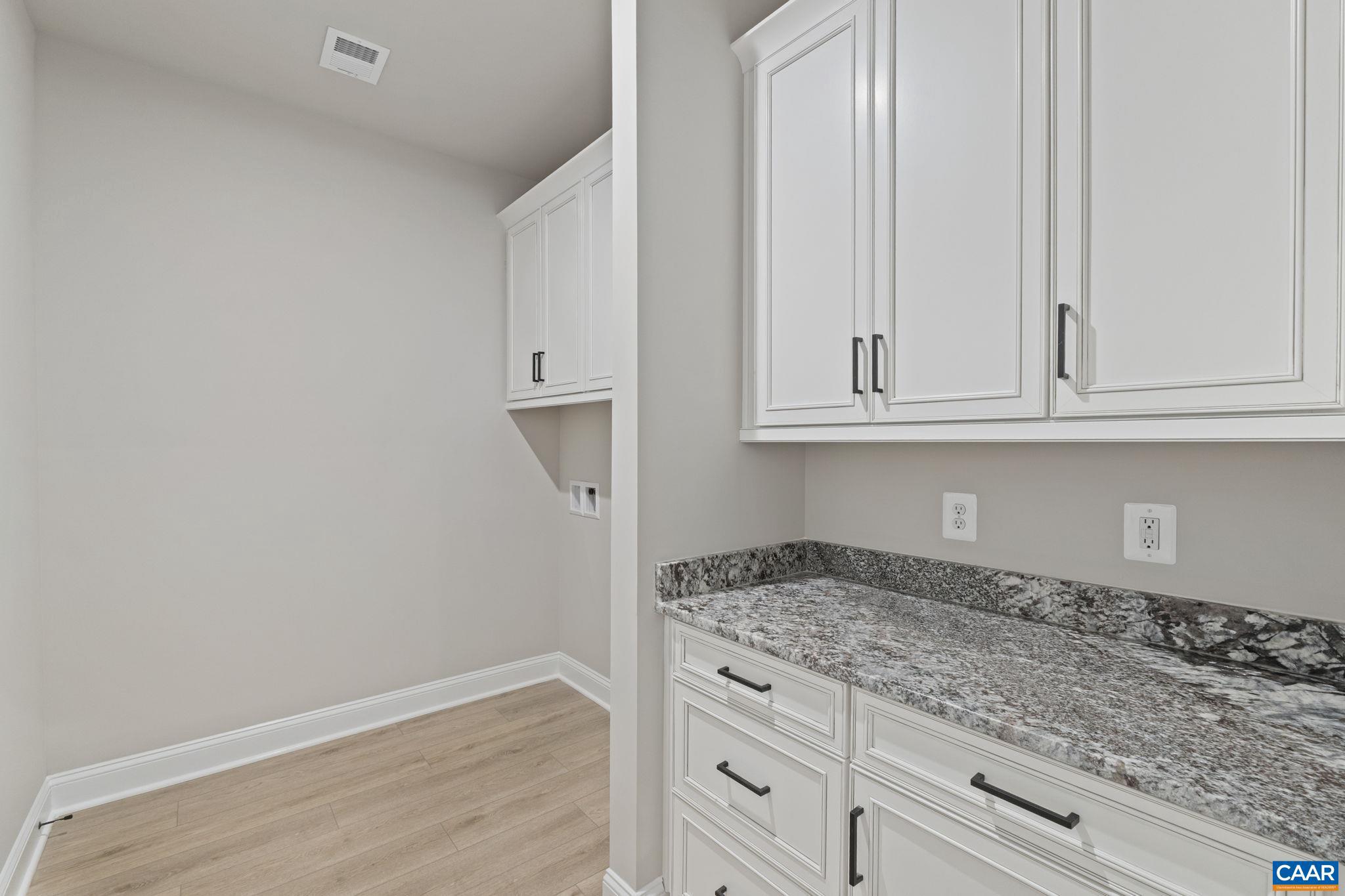 84 Springdale Road Waynesboro, VA 22980 - Photo 25 of 55 a kitchen with granite countertop white cabinets and sink