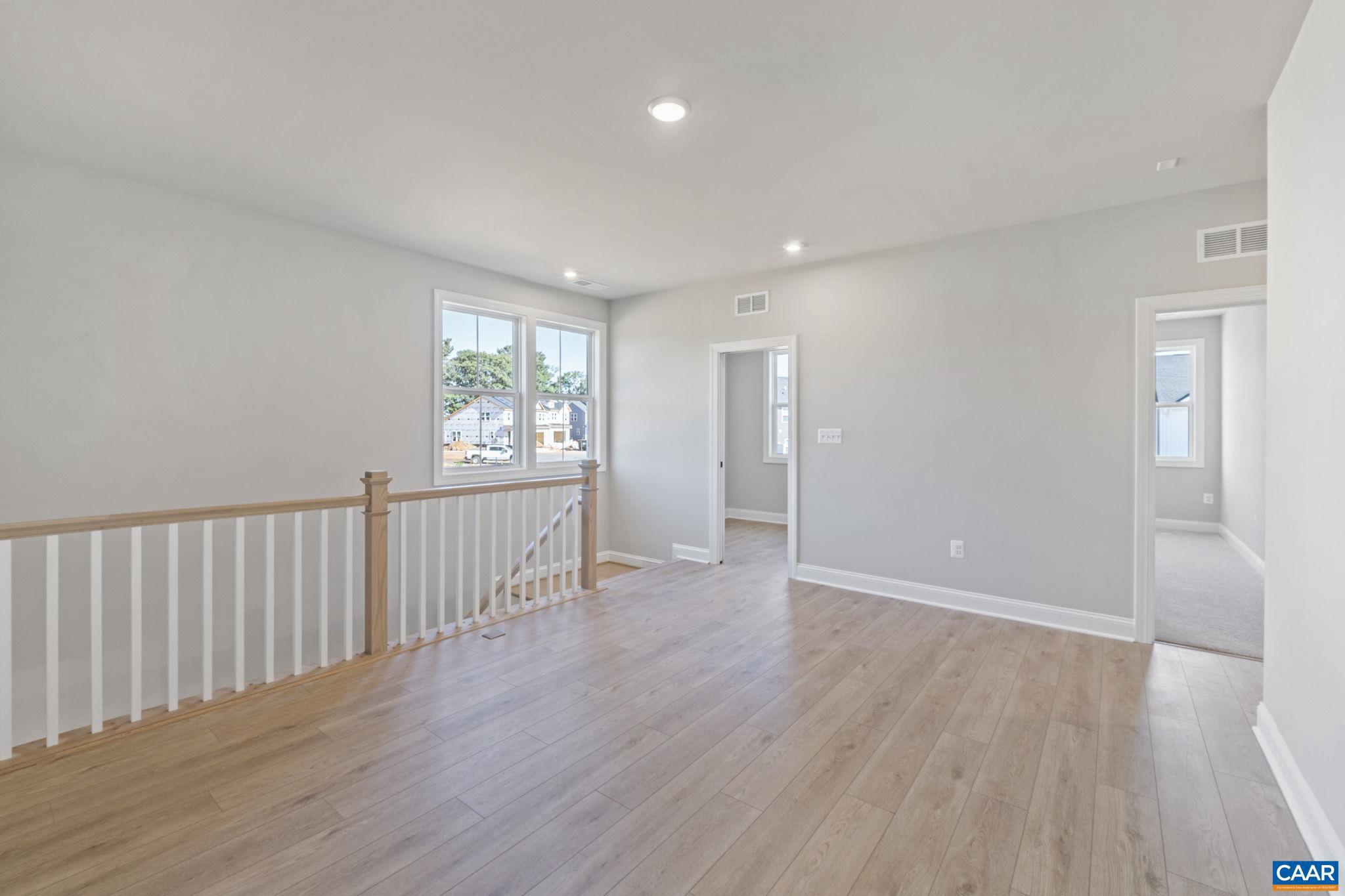 84 Springdale Road Waynesboro, VA 22980 - Photo 29 of 55 a view of an empty room with wooden floor and a window