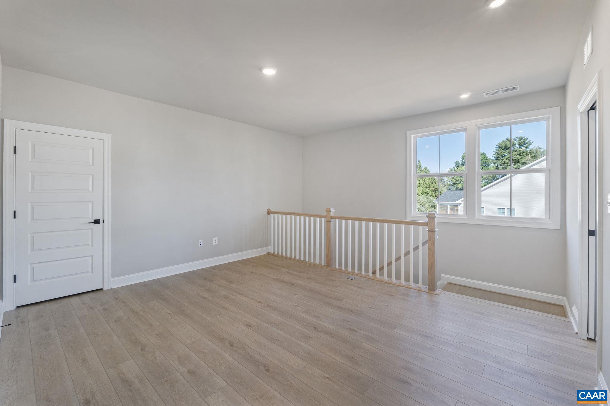 84 Springdale Road Waynesboro, VA 22980 - Photo 31 of 55 an empty room with wooden floor and windows