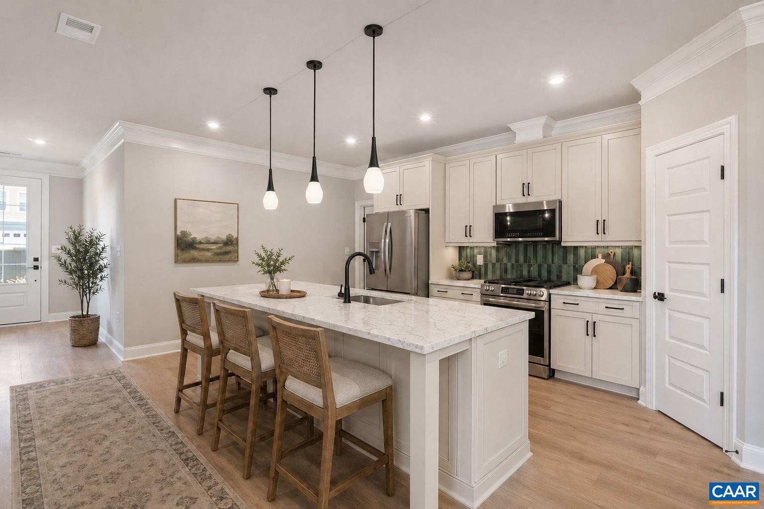 84 Springdale Road Waynesboro, VA 22980 - Photo 52 of 55 a kitchen with stainless steel appliances kitchen island a table chairs sink and cabinets