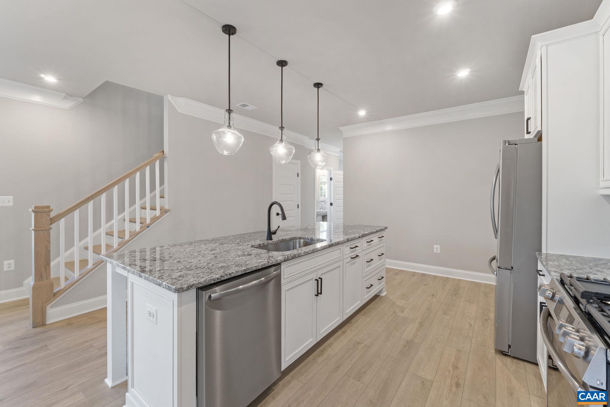84 Springdale Road Waynesboro, VA 22980 - Photo 10 of 55 a kitchen with stainless steel appliances granite countertop a sink a stove a refrigerator and a wooden floor