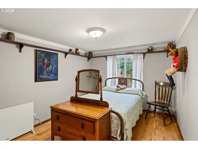 a living room with furniture and a dresser