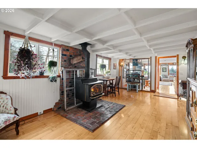a living room with a table and a potted plant