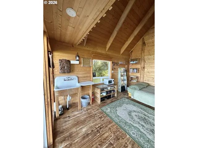 a view of a living room with furniture and a window
