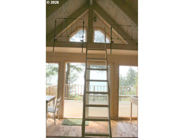 a view of a chairs and table in patio