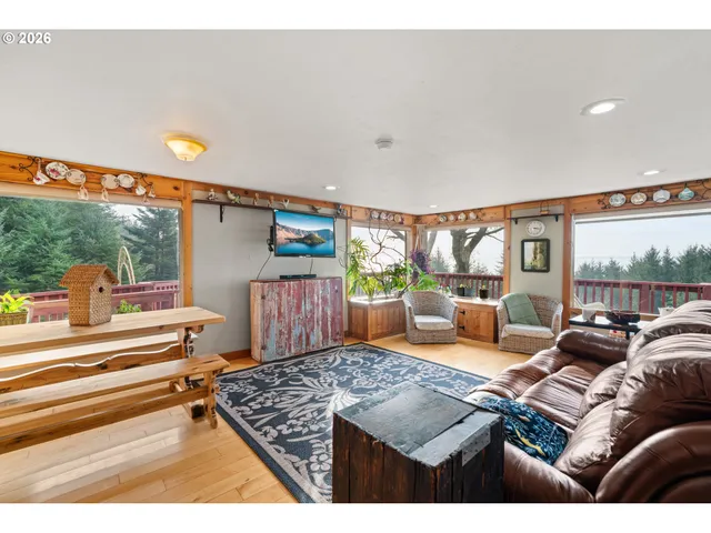 a living room with furniture and a rug