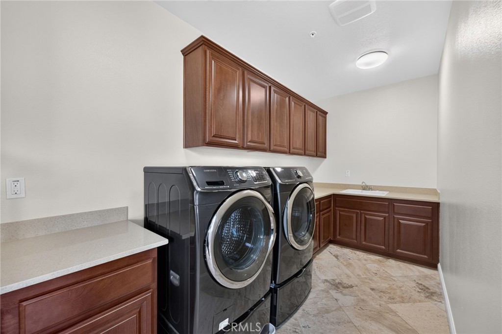 31749 Country View Road Temecula, CA 92591 - Photo 43 of 68 a utility room with sink dryer and washer