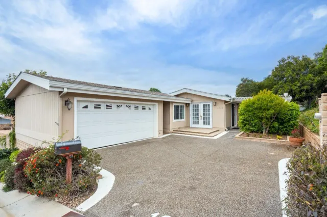 front view of a house with a street