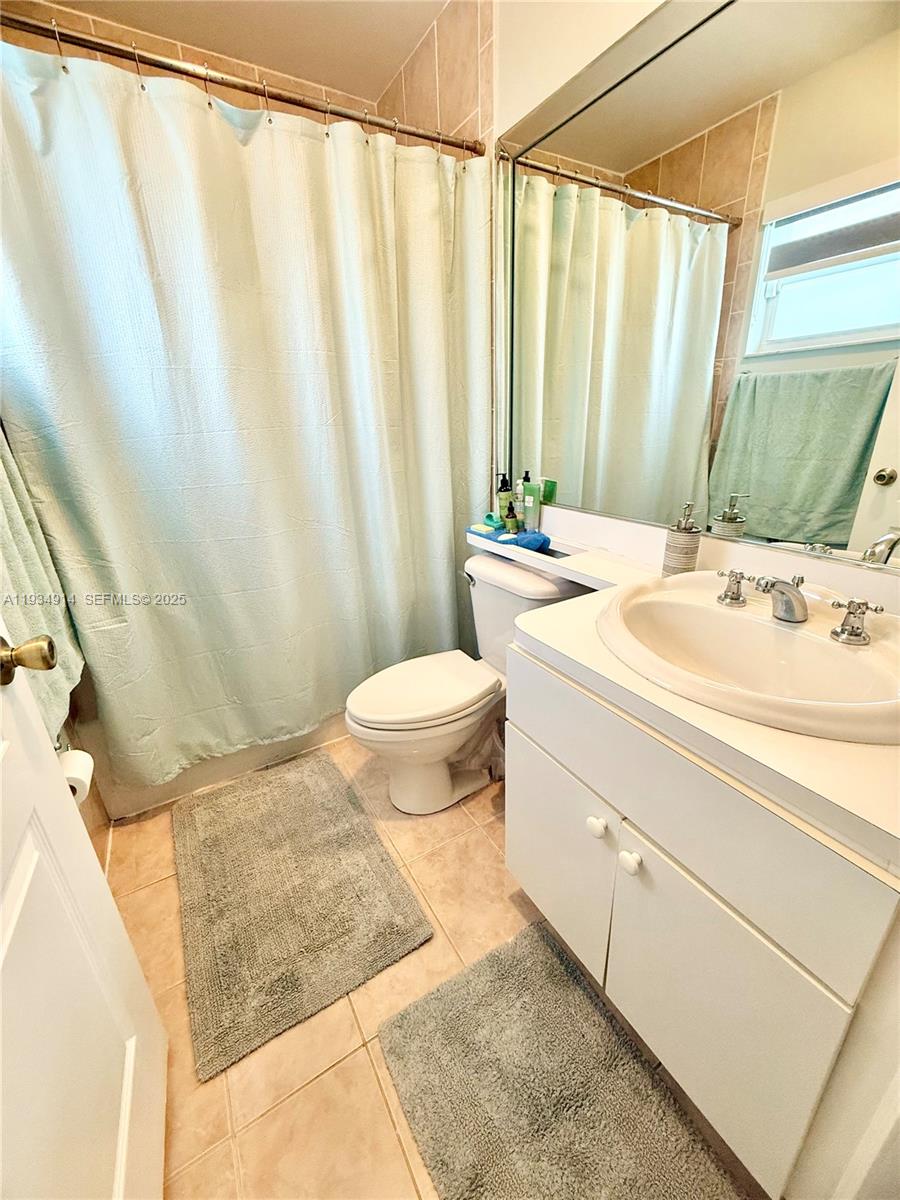 13267 Southwest 277th Terrace Homestead, FL 33032 - Photo 12 of 23 a bathroom with a sink and a mirror