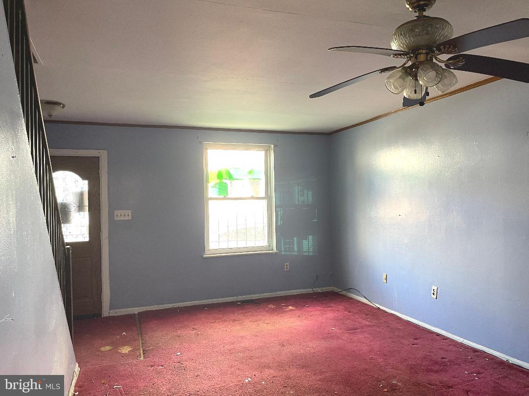 1609 Gales Street Northeast Washington, DC 20002 - Photo 11 of 29 an empty room with a window and a chandelier fan