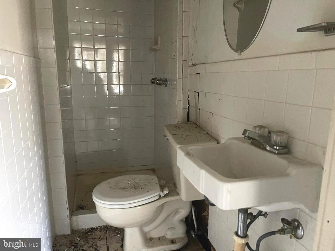 1609 Gales Street Northeast Washington, DC 20002 - Photo 13 of 29 a bathroom with a toilet and a sink