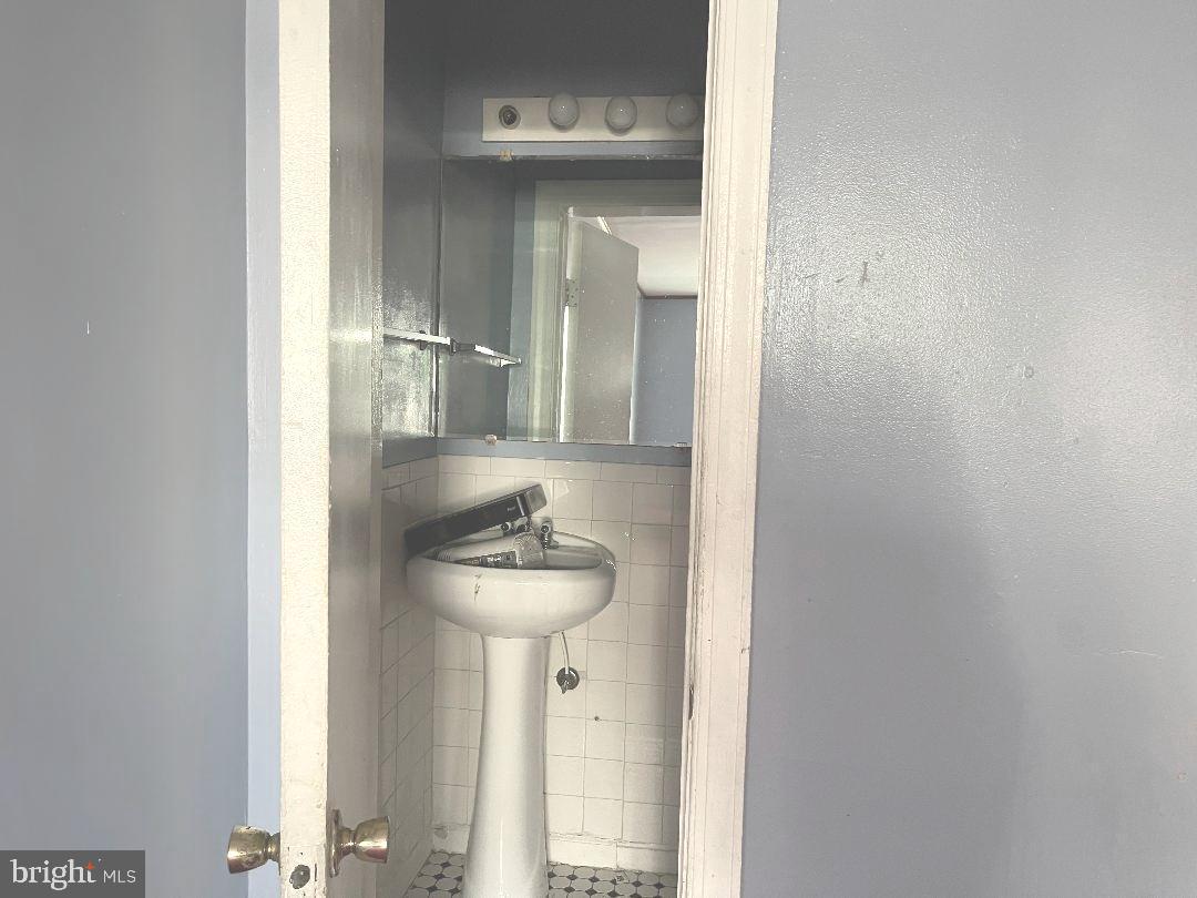 1609 Gales Street Northeast Washington, DC 20002 - Photo 17 of 29 a bathroom with a sink and a mirror