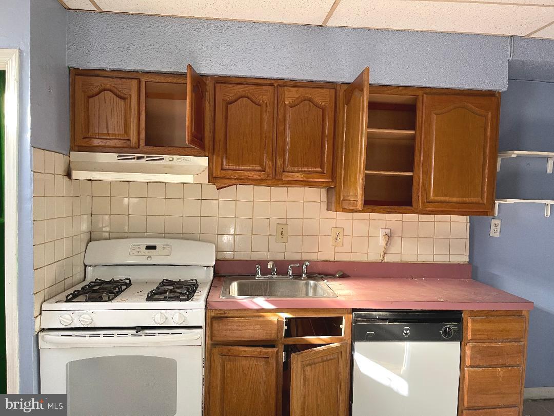 1609 Gales Street Northeast Washington, DC 20002 - Photo 6 of 29 a kitchen with granite countertop a stove top oven