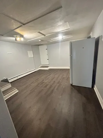 an empty room with wooden floor
