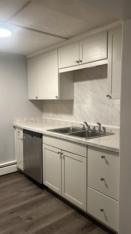 91 Columbia Street, Unit 1 Fall River, MA 02721 - Photo 4 of 5 a kitchen with granite countertop white cabinets and a sink