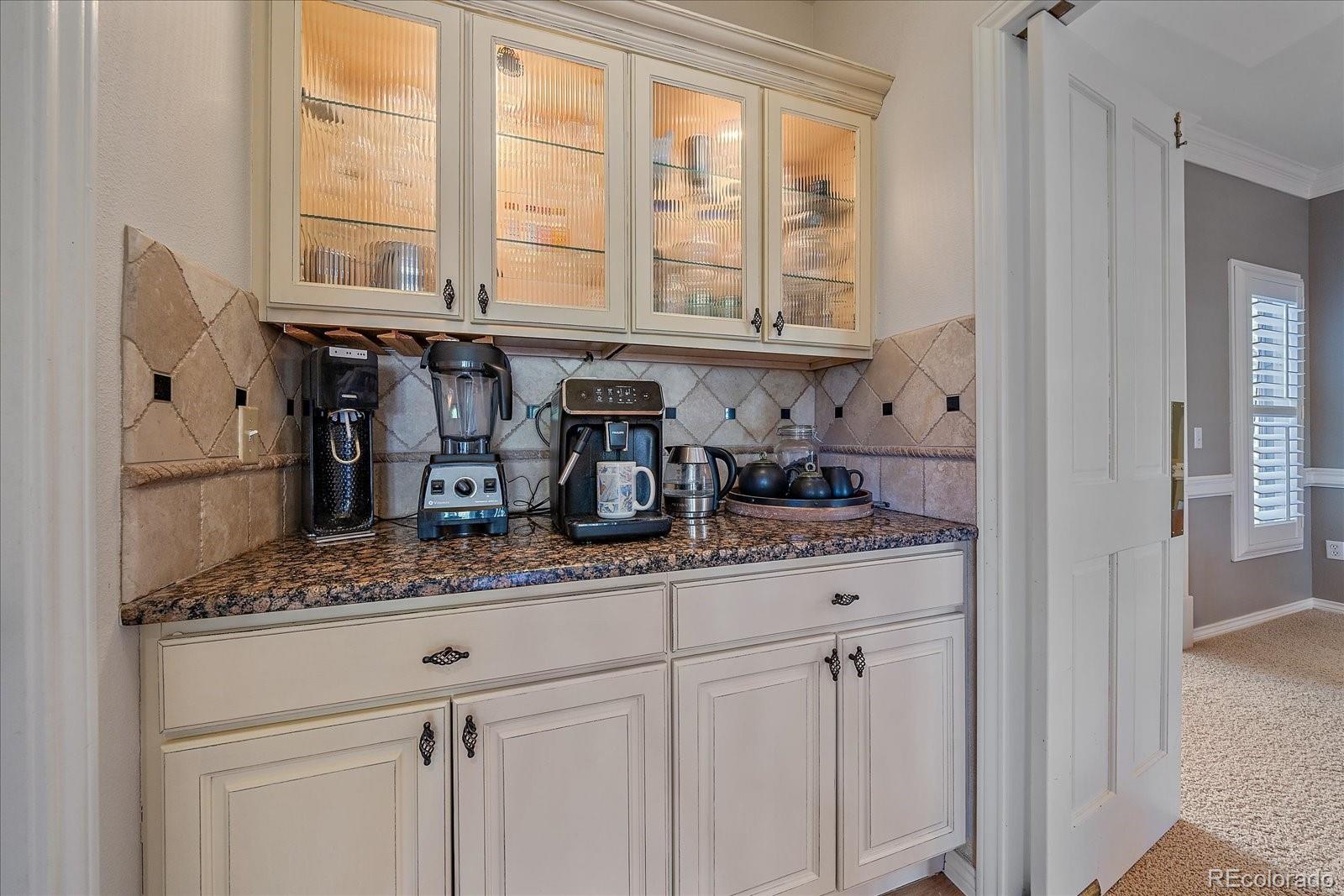 73 North Ranch Road Littleton, CO 80127 - Photo 11 of 49 a kitchen with stainless steel appliances granite countertop a sink and a window