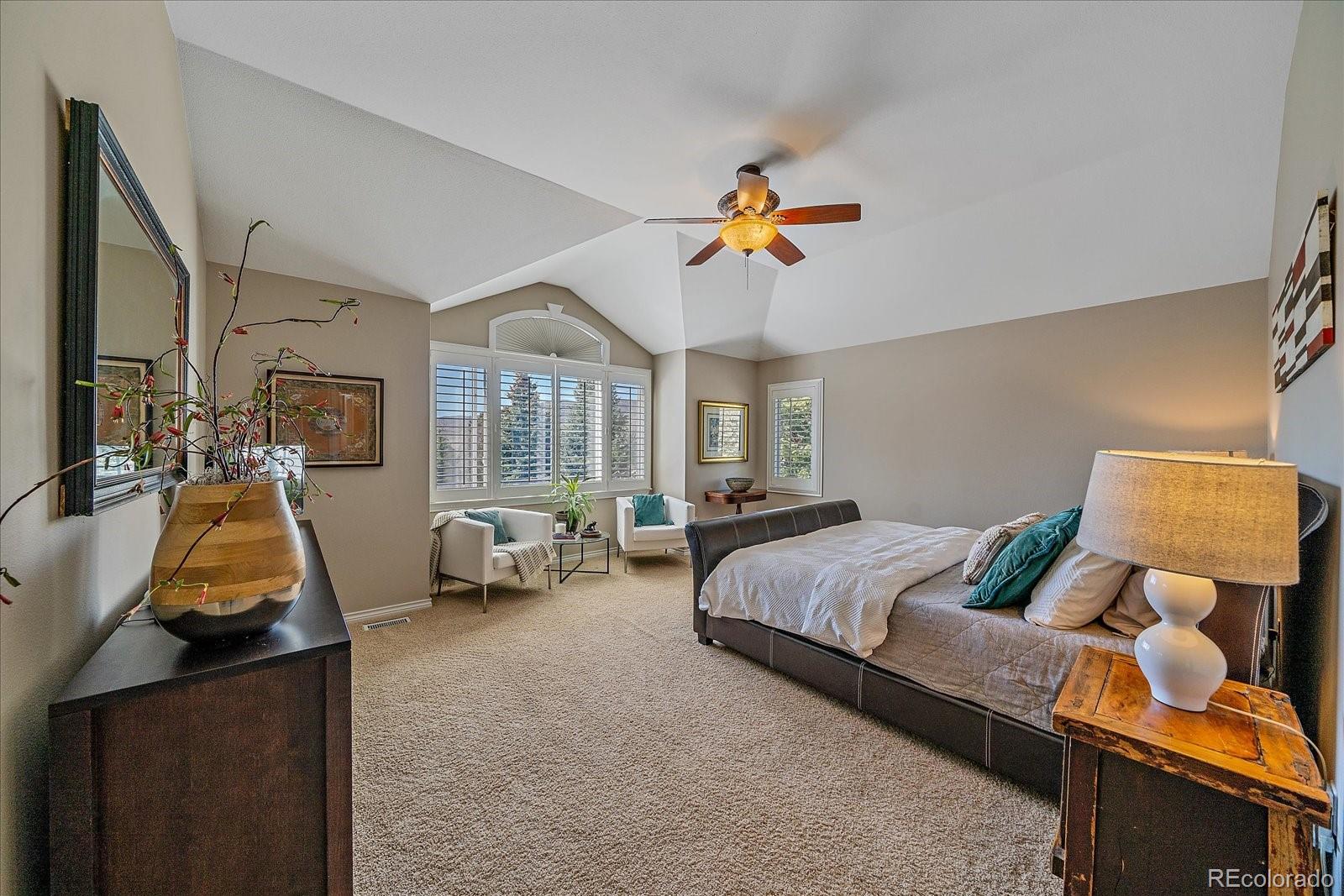 73 North Ranch Road Littleton, CO 80127 - Photo 17 of 49 a bedroom with 2 bed and a chandelier