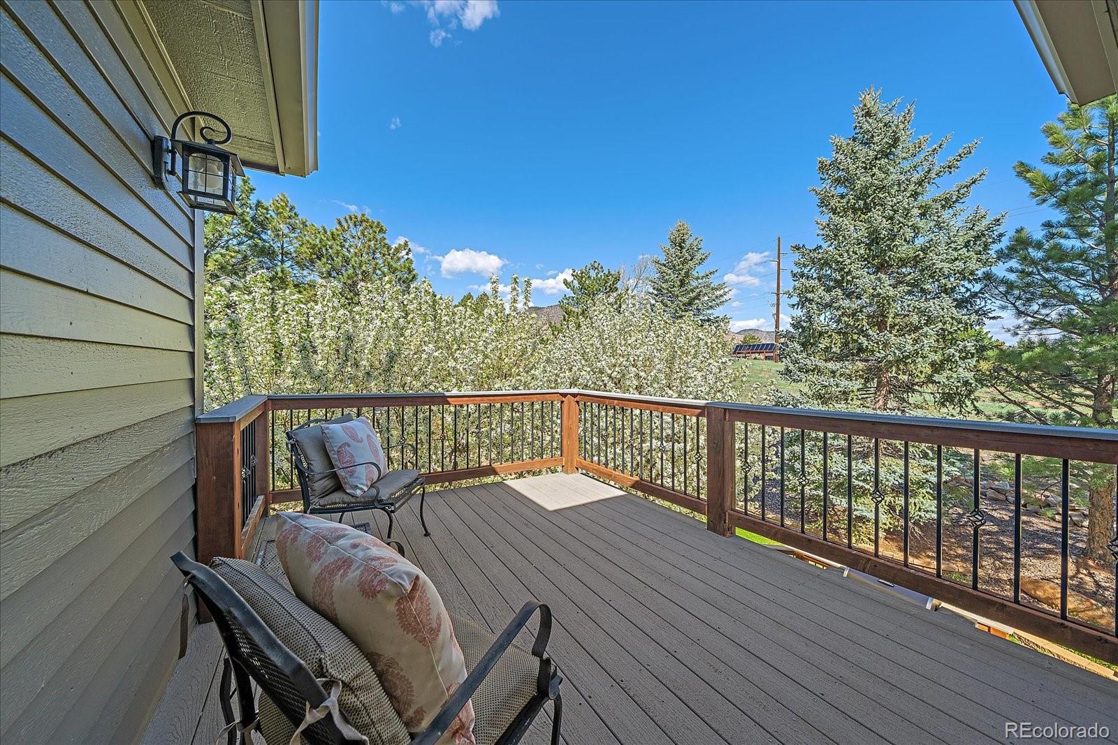 73 North Ranch Road Littleton, CO 80127 - Photo 21 of 49 a balcony with wooden floor