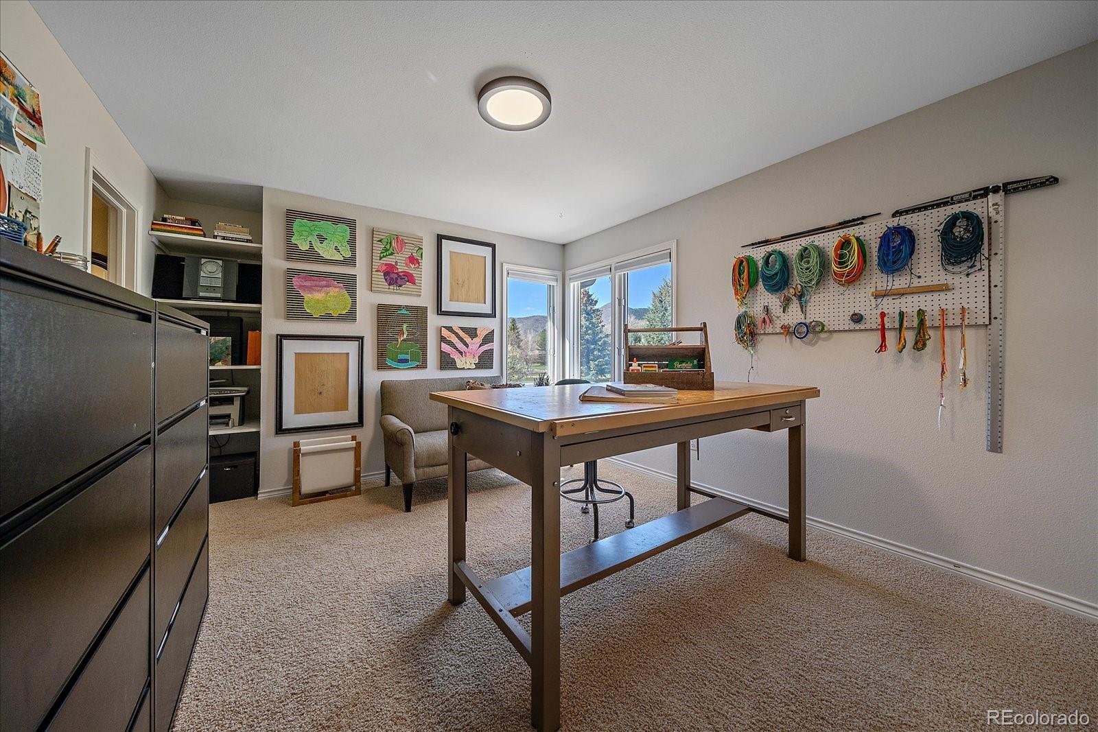 73 North Ranch Road Littleton, CO 80127 - Photo 26 of 49 a view of a workspace with furniture