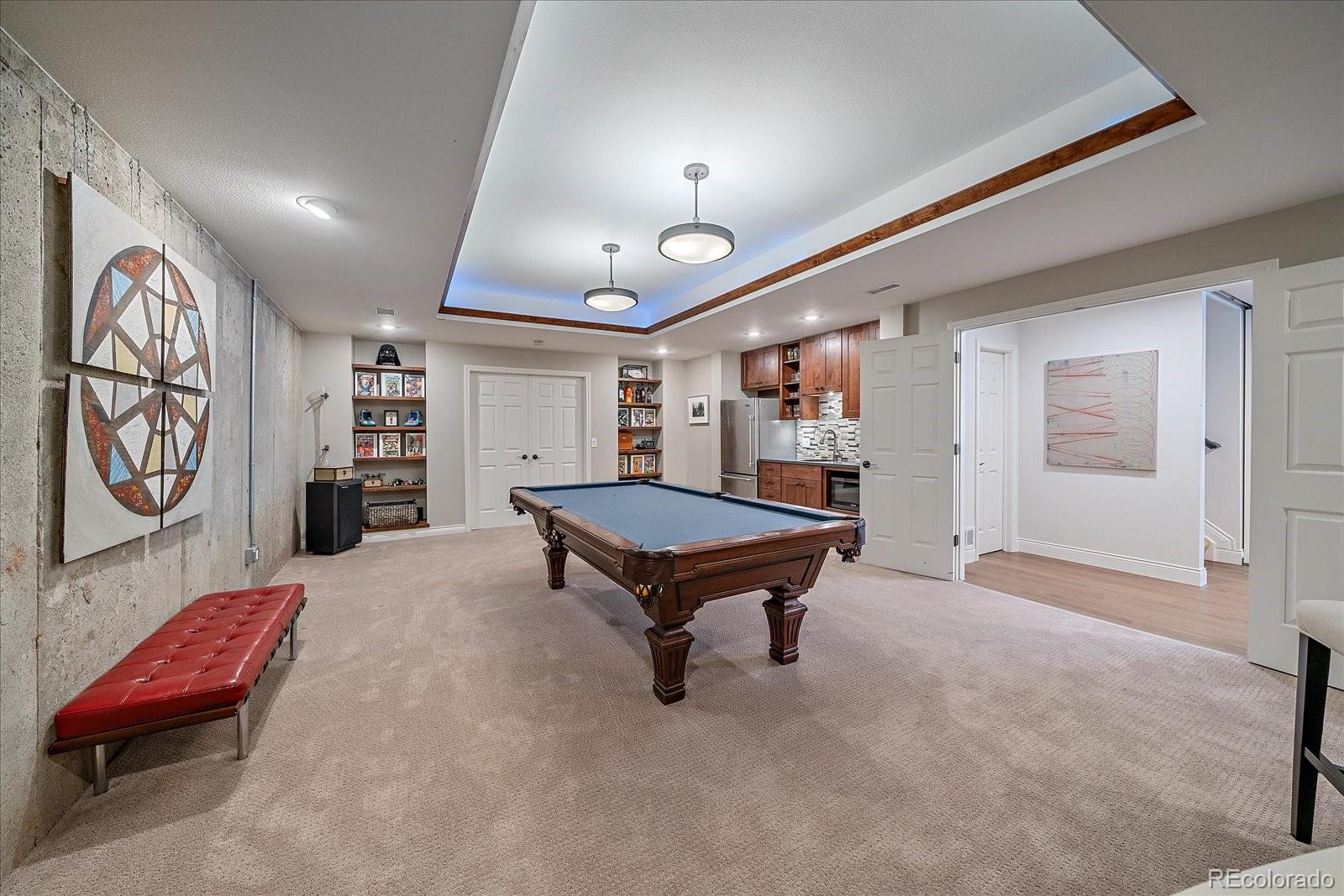 73 North Ranch Road Littleton, CO 80127 - Photo 30 of 49 a living room with furniture and a table