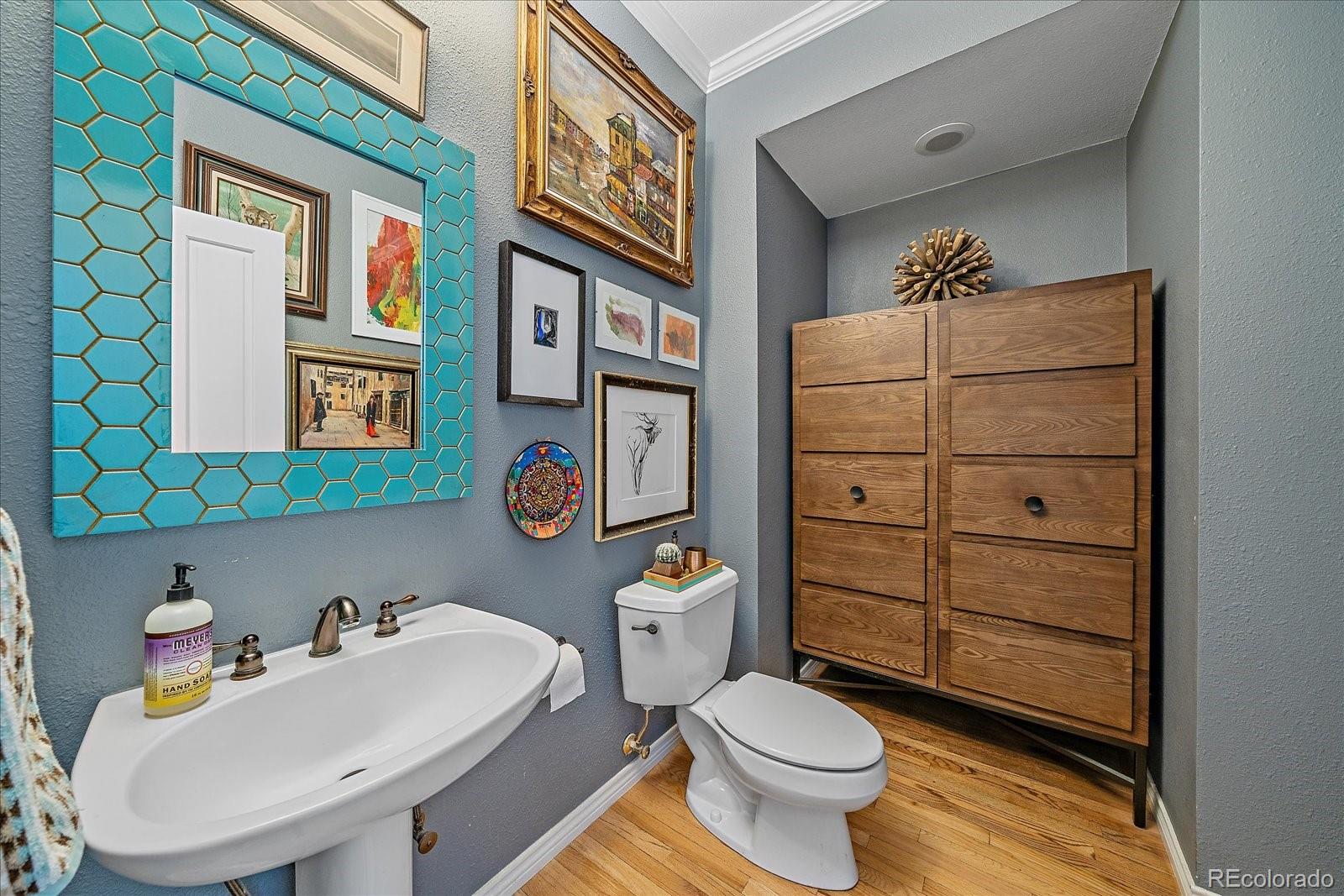 73 North Ranch Road Littleton, CO 80127 - Photo 7 of 49 a bathroom with a sink a toilet and shower