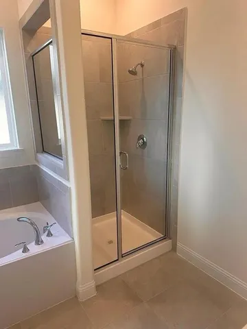 a view of wooden floor and windows in a room